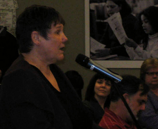 PHOTO CAPTION University of Washington Virginia Stimpson speaking in opposition to Discovery math textbooks. May 6, 2009.