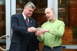 PHOTO CAPTION Mayor Greg Nickels (left) examines a petri dish with David Sherman (right), the director of the tuberculosis program at the Seattle Biomedical Research Institute on Westlake Avenue.