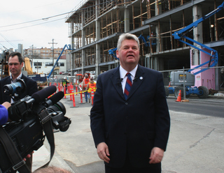 PHOTO CAPTION Mayor Greg Nickels takes questions in front of an Amazon construction site. The 10 new buildings along Mercer and Republican will be Amazon's new headquarters and could accommodate as many as 5,000 employees.