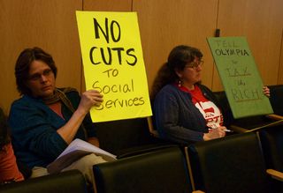 PHOTO CAPTION Signs protesting budget cuts.